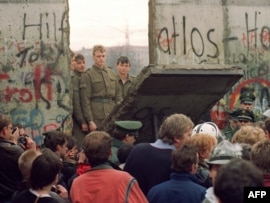 The Berlin Wall came down almost one year before reunification.