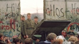 The Berlin Wall came down almost one year before reunification.