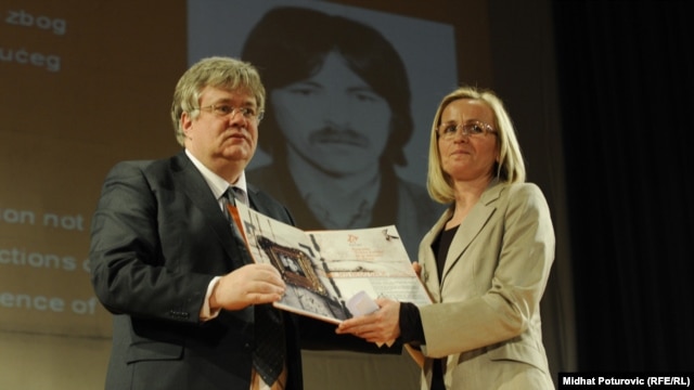 Stefica Galic (right) receives an award for bravery on behalf of her late husband, Nedeljko Galic, in Sarajevo in April.