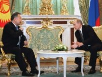 Russian President Vladimir Putin (right) speaks with Kyrgyz President Kurmanbek Bakiev during their April 24 meeting in the Kremlin (epa)