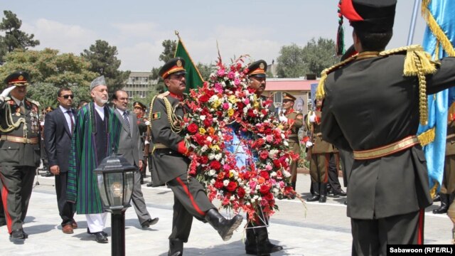 Afghan President Hamid Karzai prepares to lay a wreath at Independence Day celebrations in Kabul on August 18.