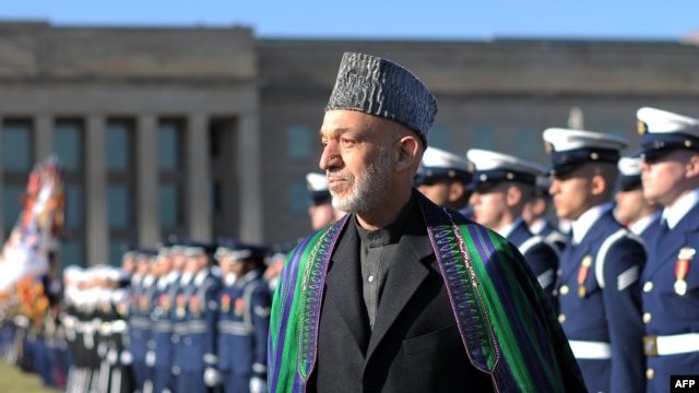Afghan President Hamid Karzai was honored with a military ceremony outside the Pentagon on January 10.