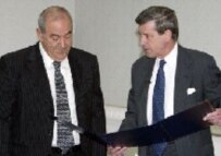 CPA head L. Paul Bremer and interim Prime Minister Iyad Allawi at formal handover on 28 June 2004