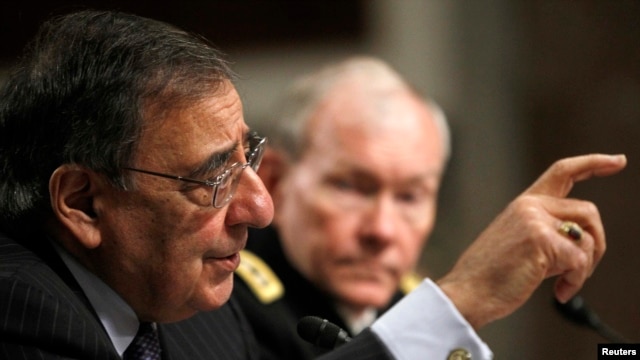 U.S. Secretary of Defense Leon Panetta (left) and U.S. Army General Martin Dempsey, the chairman of the Joint Chiefs of Staff, testify before the Senate Armed Services Committee on February 7.
