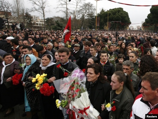 People attend a march to commemorate the three victims of last week's deadly riots in Tirana.