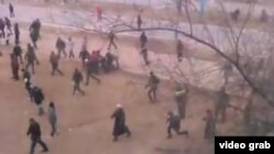 A still from an amateur video taken as protesters fled police in Zhanaozen on December 16, 2011.
