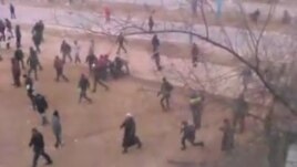 A still from an amateur video taken as protesters fled police in Zhanaozen on December 16, 2011.