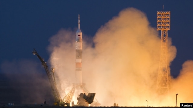 The Soyuz TMA-07M spacecraft carrying a three-man crew blasts off from the Baikonur Cosmodrome.