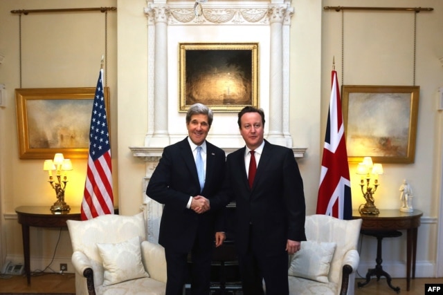 British Prime Minister David Cameron (right) meets with Kerry at 10 Downing Street.