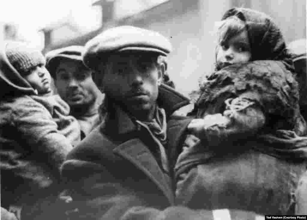 A man holds a girl.