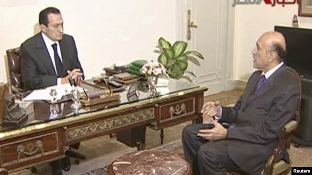 As vice president, Omar Suleiman (right) became a conspicuous face as the Arab Spring events culminated in the ouster of Egyptian President Hosni Mubarak. Here the two are meeting one day before Mubarak's resignation.