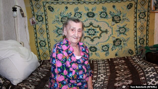 Anna Krikun, 90, in the bedroom of her apartment, where she lives alone