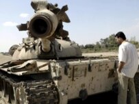 Man looks at an Iraqi tank damaged in 2003 near Al-Basrah (epa)