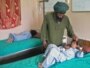 Abdul Ghaffar comforts his wounded child at a hospital in southern Kandahar city on July 24.