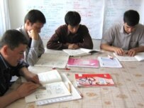 Uzbek refugees studying Czech at a camp at Straz pod Ralskem (RFE/RL)