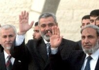 Palestinian Interior Minister Said Siam (left), Prime Minister Ismael Haneiya (center), and Foreign Minister Mahmud al-Zahar (right) at the Hamas swearing-in ceremony in Gaza City, March 29 (epa)