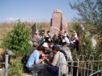 A commmemoration service at the site of the Aksy events on March 16 (RFE/RL)