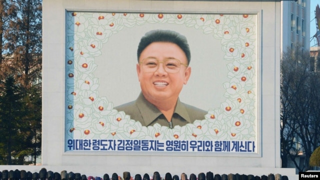 People bow in front of a portrait of late leader Kim Jong Il in Pyongyang.