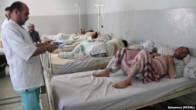 Medical staff tend to some of those injured in the July 4 explosion of a propane-gas reservoir in Kabul.