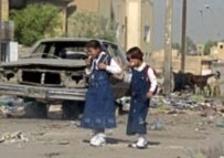 Schoolchildren eating ice cream on their way to school in Baghdad's Al-Sadr City