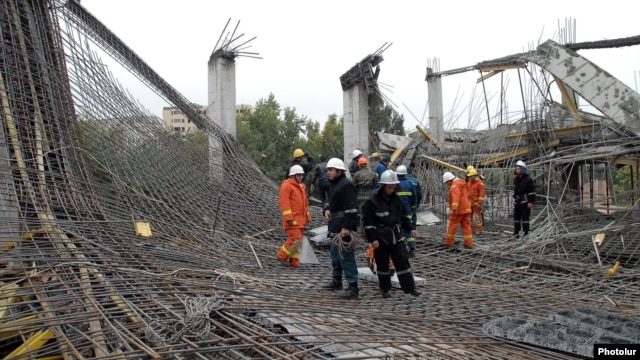 Rescue workers at the scene of the collapse on October 25.
