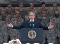 Bush addresses U.S. troops at Camp Arifjan in Kuwait on an earlier leg of his Mideast tour. (epa)
