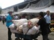 A youth transports a load of vegetables at a market in the Tajik capital, Dushanbe (RFE/RL)