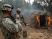 U.S. soldiers burn a suspected Taliban shelter on the Afghan-Pakistani border in March 2007
