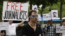 France/Iran – Reporters without Borders protests in front of the Iran Air offices to denounce the imprisonment of journalists in Iran and to commemorate the 10th anniversary of the death in jail of the Iranian photojournalist Zahra Kazemi, Paris, 10Jul2012 