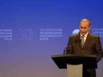 President Vladimir Putin addresses the economic forum in St. Petersburg on June 10 (ITAR-TASS)