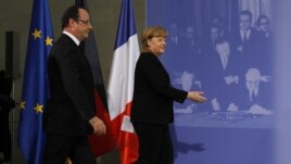 Angela Merkel şi Francois Hollande la ceremoniiile de la Berlin