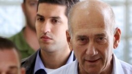 Ehud Olmert (right), seen here in custody in 2009, served as Israel's prime minister from 2006 to 2008.
