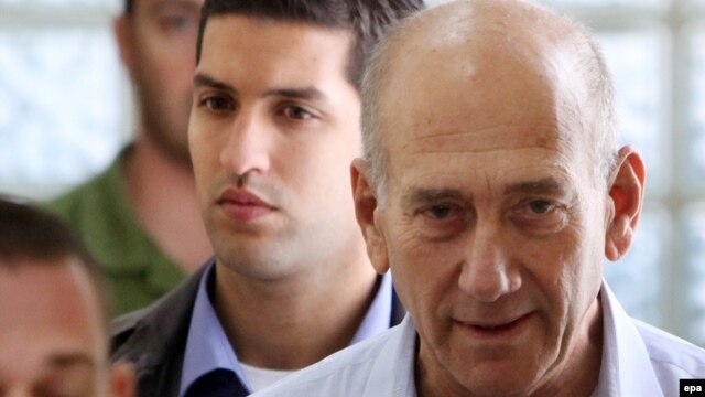 Ehud Olmert (right), seen here in custody in 2009, served as Israel's prime minister from 2006 to 2008.