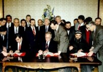 The signing of a cease-fire agreement that ended hostilities in December 1996 (TASS)
