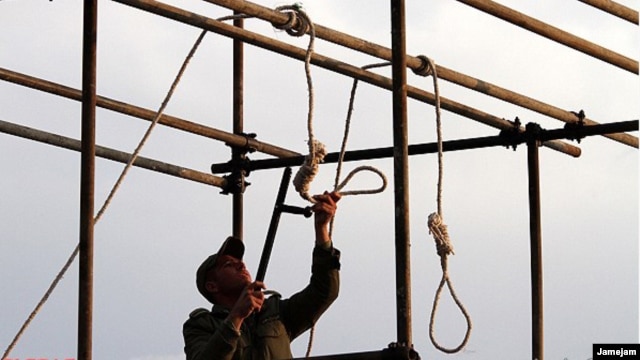 An Iranian soldier prepares a noose ahead of  a public hanging. Will watching a video of such a hanging spur opposition to the practice, or just desensitize the viewer?