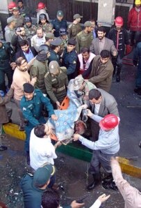 Firemen remove the body of a victim of the 24 January bombings in Ahvaz (file photo) (epa)