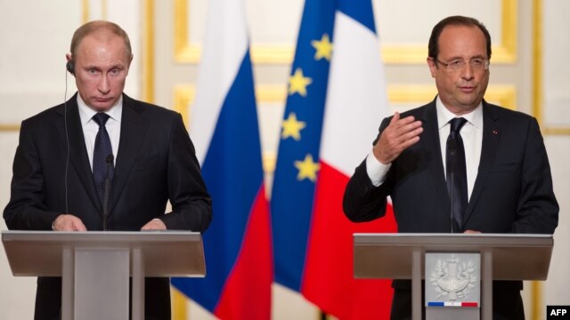 Russian President Vladimir Putin (left) met in Paris with French President Francois Hollande in June.