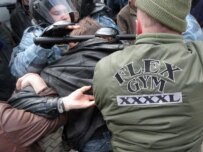 Police arrest a protester at the April 14 March of Dissent rally in Moscow (RFE/RL)
