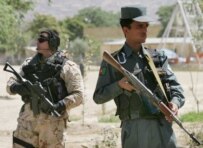 A Romanian soldier (left) on patrol with Afghan police in Kabul in June (epa)