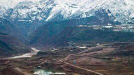 Construction of the dam near the Vakhsh River, seen on the left