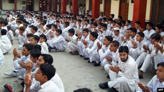 Students pray for the early recovery of Malala Yousafzai at a government school in Mingora, the main town of the northwestern Swat Valley.