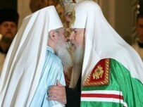 Sealed with a kiss: Patriarch Aleksy II (right) and Metropolitan Lavr (AFP)