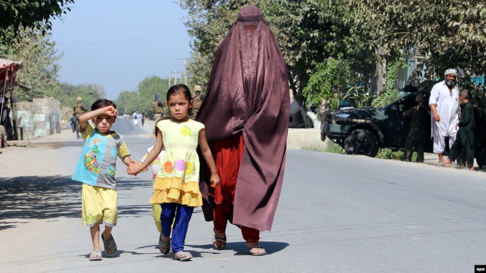 An Afghan family leaves Kunduz following clashes between Taliban and Afghan security forces.