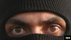 The face of a masked Basij member during a paramilitary forces parade (file photo)