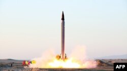 A picture released on October 11 by Iran's Defense Ministry on their website reportedly shows the launch of an Emad missile during tests at an undisclosed location in Iran.