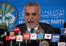Iraq -- Tariq al-Hashimi, Head of Iraqi Islamic party and Sunni leader, addresses to the media during a press conference in the headquarters of Iraqi Islamic party in Baghdad, 30 Mar. 2006