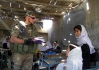 An ISAF soldier visiting a destroyed school in Kabul on October 19 (epa)