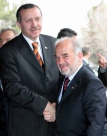 Turkey/Iraq -  Iraqi Prime Minister Ibrahim al-Ja'afari (R) and Turkish Prime Minister Recep Tayyip Erdogan shake hands as they pose for media before their meeting in Ankara, 28 Feb. 2006