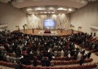 Members of the new parliament are sworn in during the first session of the Iraqi National Assembly in Baghdad three months after parliamentary elections, March 16 (epa)