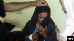 The victim of an acid attack is comforted at a local hospital in Quetta in 2010. Activists say about 150 women are attacked with acid every year in Pakistan.
